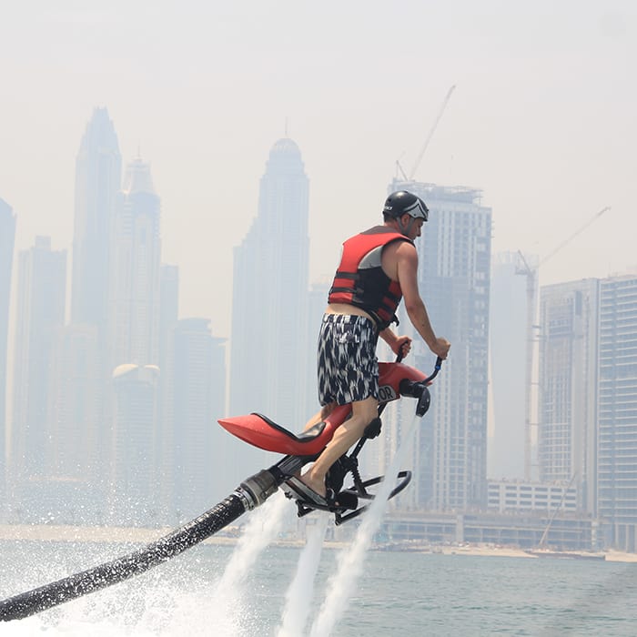 A man enjoying red jetovator in Jumeirah Beach