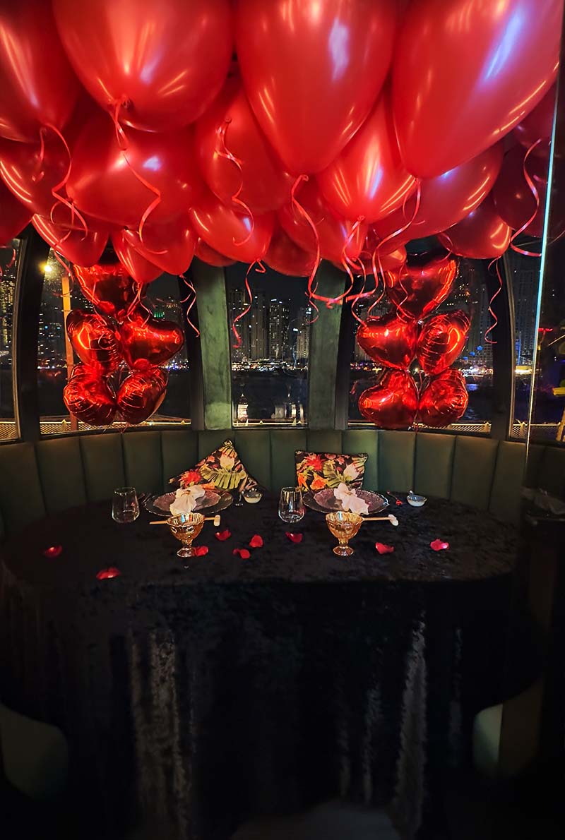 Decorated dining area with red balloons at the pods restaurant