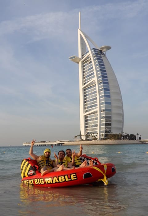 https://cdn.dojoin.com/dj/Three_guys_enjoying_donut_ride_in_front_of_burj_al_arab.jpg